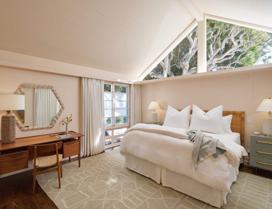 Showcasing the interior design of the master bedroom with beautiful windows and natural light