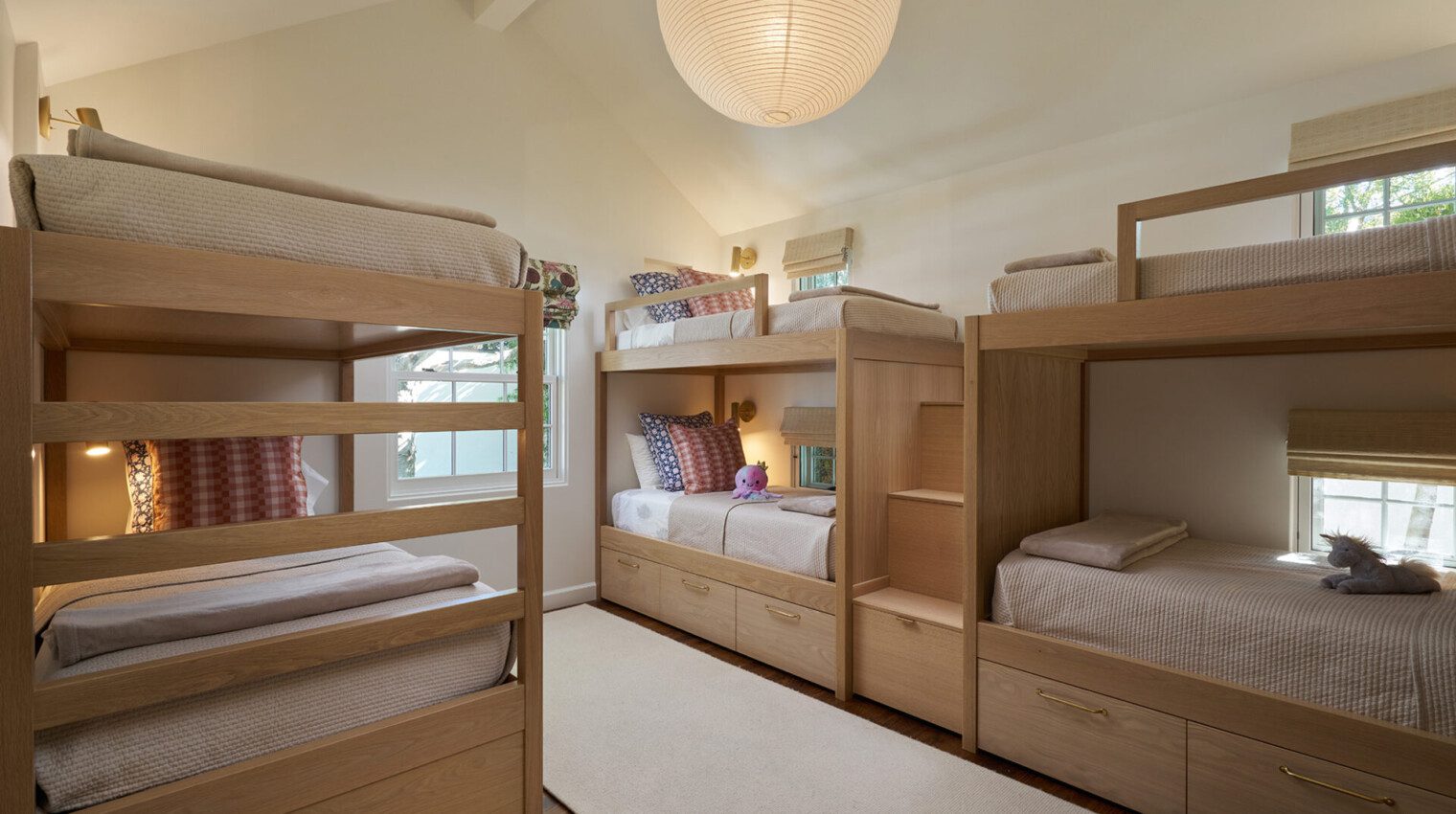 Showcasing the interior design kids room with three bunkbeds